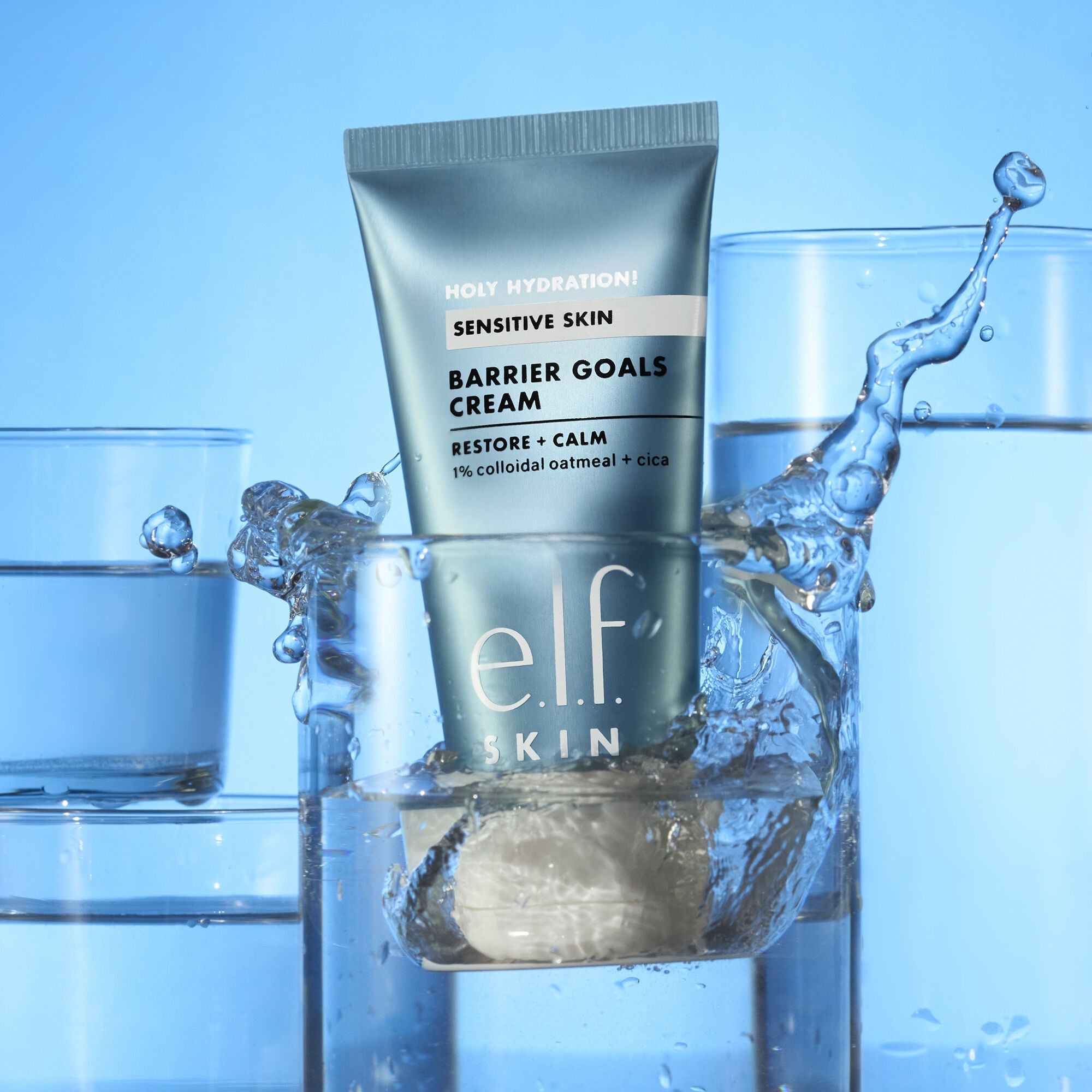 e.l.f. Skin Barrier Goals Cream tube with water splash on a blue background