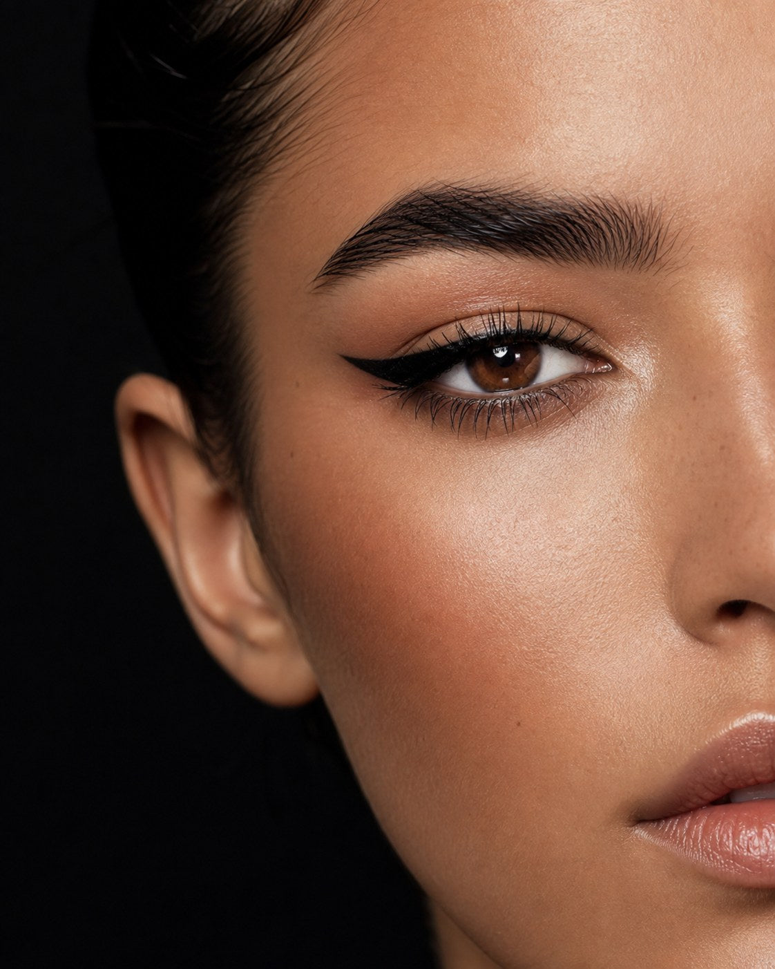 Close-up eye makeup with eyeliner and defined lashes
